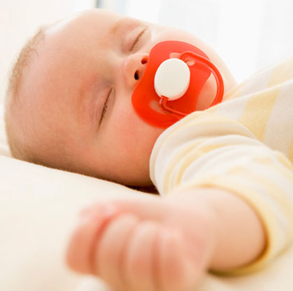 Baby sleeping with pacifer